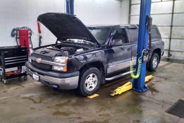 Large chevy in shop undergoing maintenance