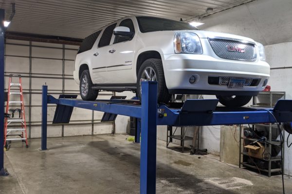 White GMC Elevated in Shop | Hy-Tech Transmissions | Greenville, IL